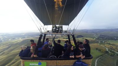View the picturesque landscape of New Zealand's Southern Alps in a hot-air balloon