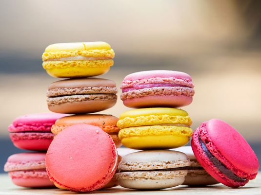 Macaron. Colorful stack of macaron pastries on a table. Sweet meringue-based confection made with egg white, icing sugar, almond powder and food clothing. Food, French cuisine, dessert, pastries, cookies