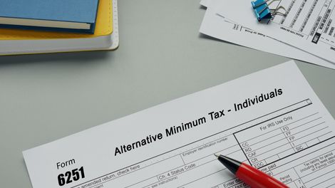 Conceptual photo about Form 6251 Alternative Minimum Tax - Individuals with written text.