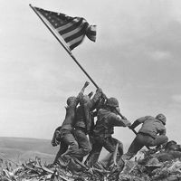 U.S. marines raising the American flag over Mount Suribachi, Iwo Jima, in February 1945